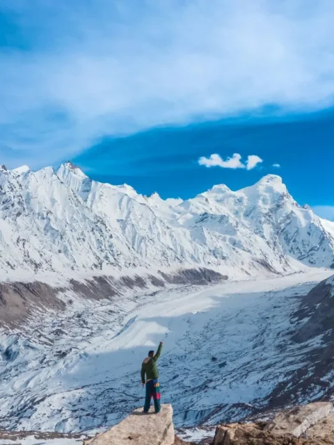 Hiker on snowy ridge in the Pyrenees.
