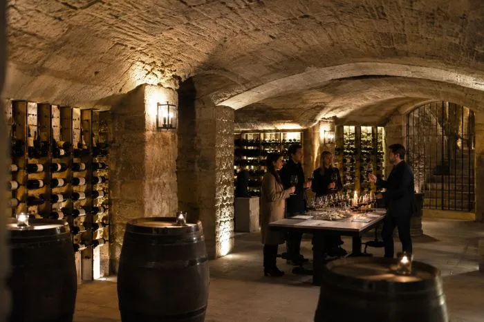 Wine tasting experience inside historic stone cellars in Paris