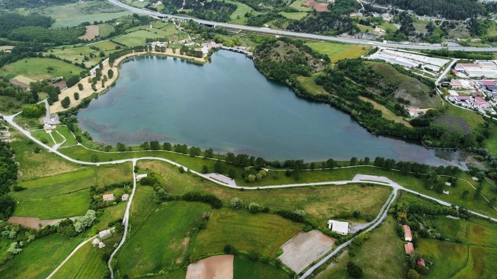 Aerial view of Lago del Pantano near Mormanno, Calabria, surrounded by green countryside