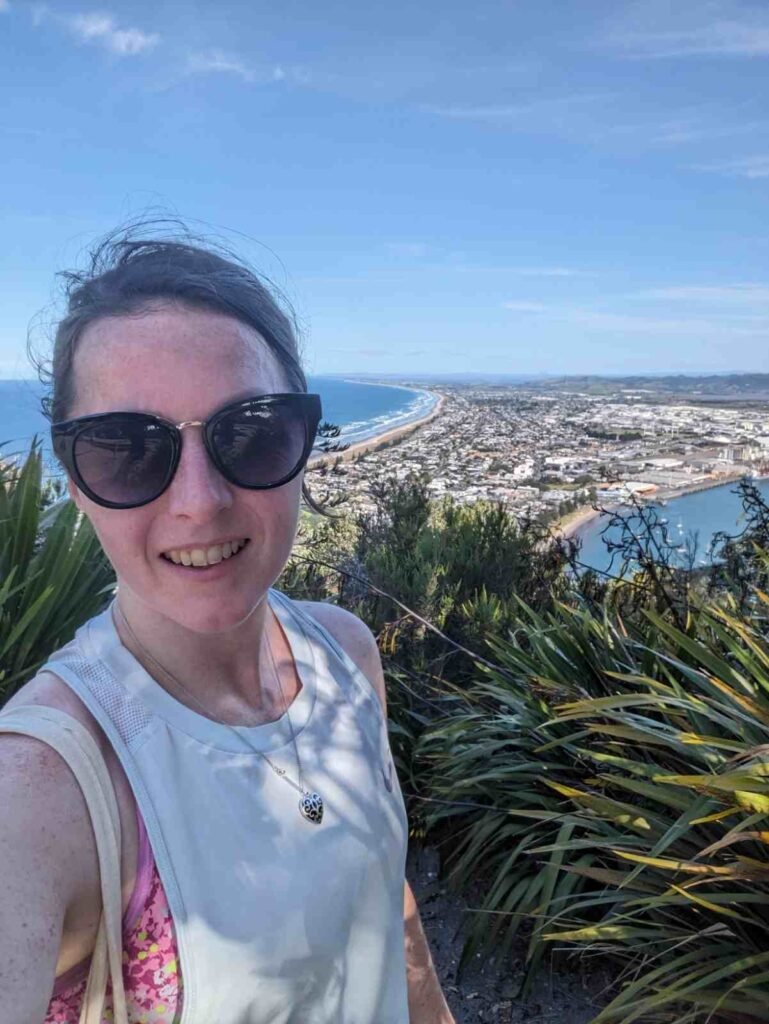 Travel contributor at a scenic Mauao viewpoint overlooking Mount Maunganui